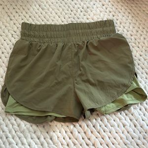 Green running shorts